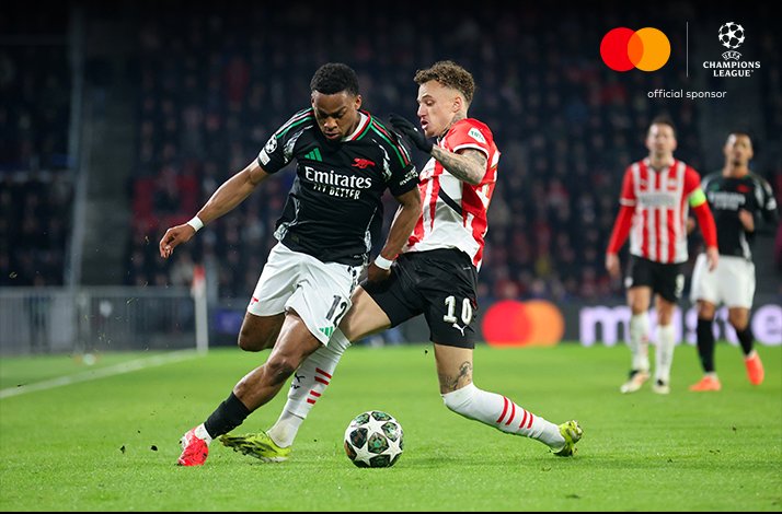 Football players photographed during UEFA Champions League match.