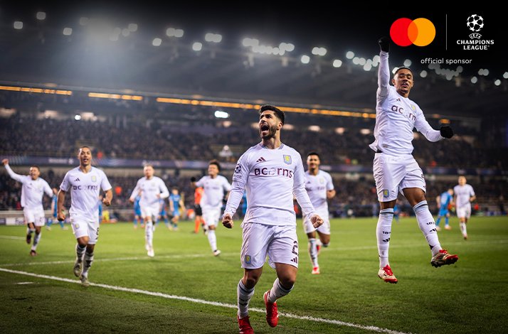 Football players photographed during UEFA Champions League match.