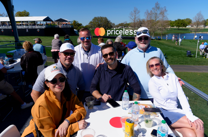 People pose during the Arnold Palmer Invitational.