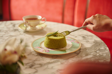 Mini matcha chiffon cake served on a decorative plate at Mandarin Oriental, Singapore.
