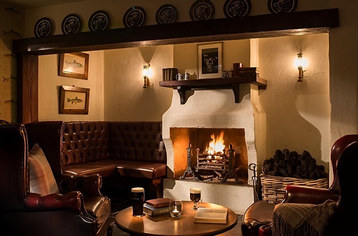 Interior of the Bushmills Inn with burning fireplace. 