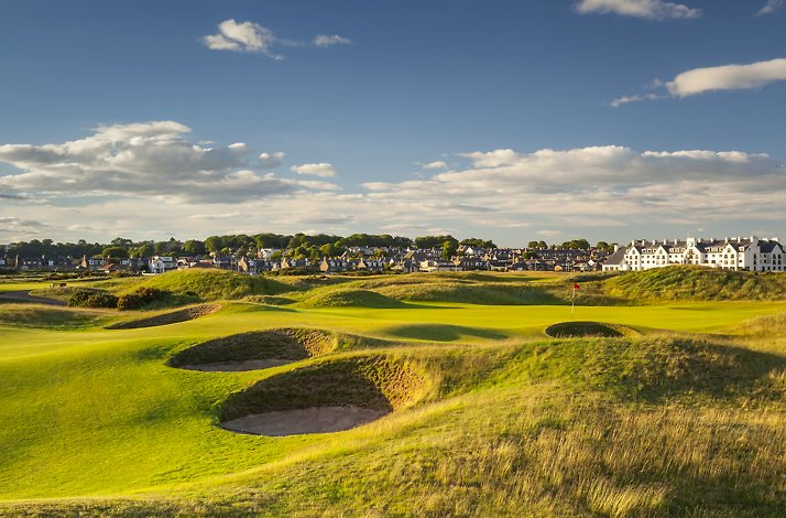 Deep sand bunkers cut into the rolling green fairway at Carnoustie Golf Links near the hotel in Scotland.