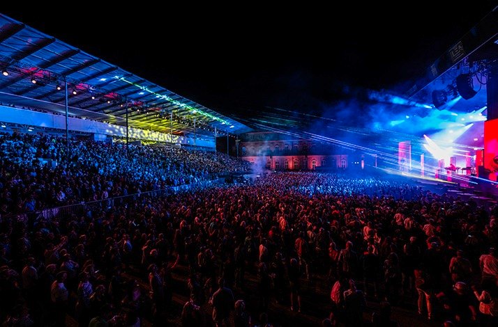 Live night concert of Jazz Open Stuttgart, featuring stage lights and huge crowds.
