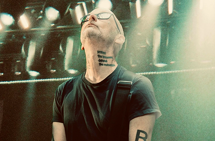 Artist Moby performing live on stage.
