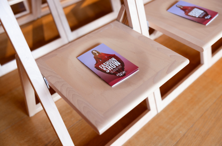 Parisian fashion show seats, provided with fashion show book for guest.