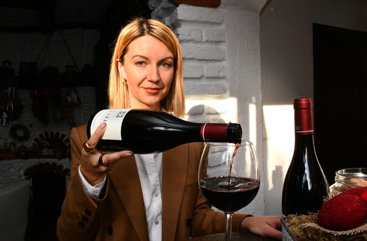 Barbara Ljevar is pouring read wine into glasses at Kaptol winery for her wine-tasting class.