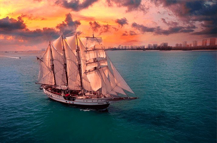 Aerial view of the Royal Albatross sailing at sunset..