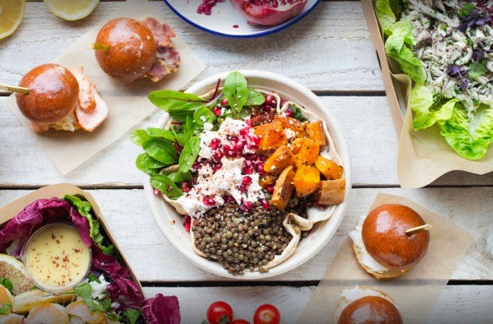 Dishes from Just Eat for Business displayed on the table.