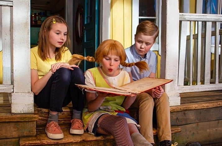 Pippi The Longstocking reading the book on the exhibition inspired by Astrid Lindgren's classic children's stories