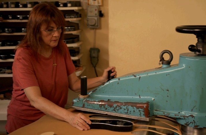 Olgianna Melissinos crafting a pair of sandals.