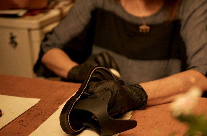 Olgianna Melissinos crafting a pair of sandals.