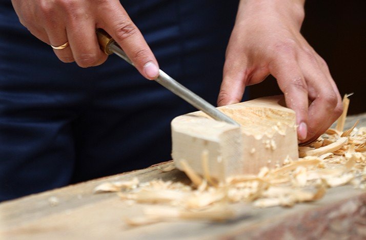 The process of creating a wooden moai on Rapa Nui by a master carver.