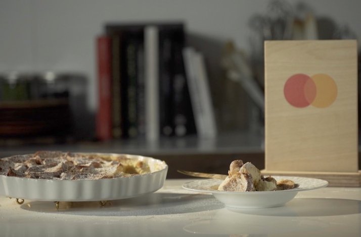 Dessert leftovers and pantry supplies are turned into two delicious desserts displayed on the table. Mastercard logo at the backend.