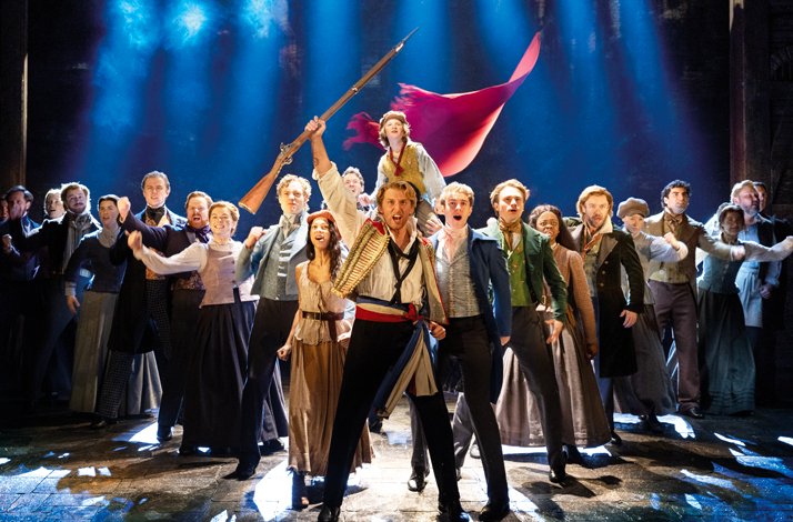 Actors performing  Les Misérables on stage of the  Sondheim Theatre, London