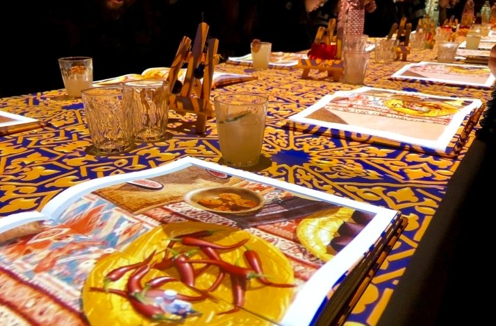 A table set with the menus rested on it at the Le Petit Chef.