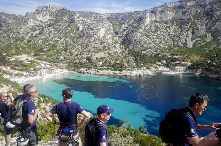 A group of tourists looking at Calanque de Sormiou