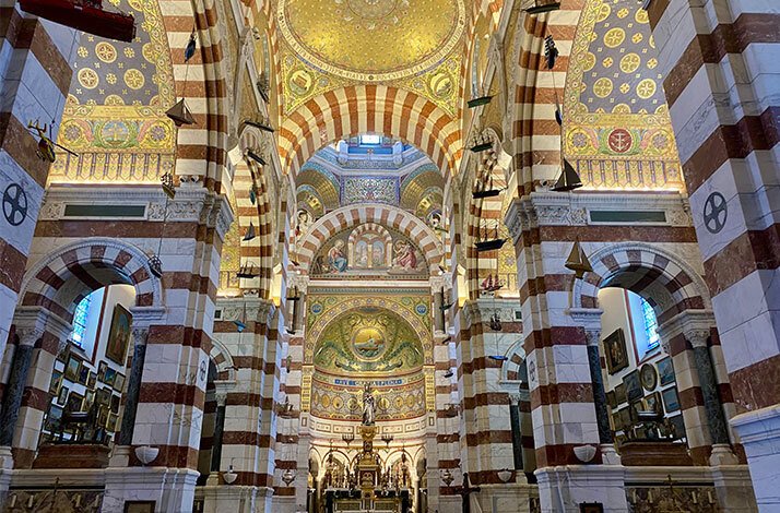 The interior of the Basilica of Notre-Dame of la Garde enriched with old frescos on the walls