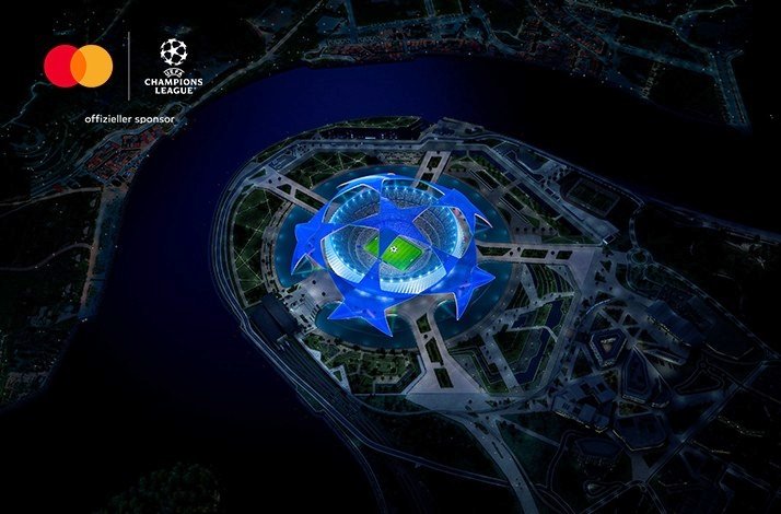 Bird's eye view at a football stadium. There is a joint logo of UEFA Champions League and Mastercard in the top left corner.
