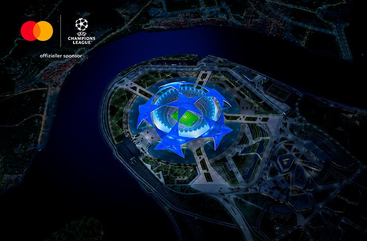 Bird's eye view at a football stadium. There is a joint logo of UEFA Champions League and Mastercard in the top left corner.