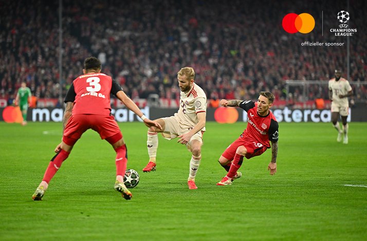 Football players photographed during UEFA Champions League match.