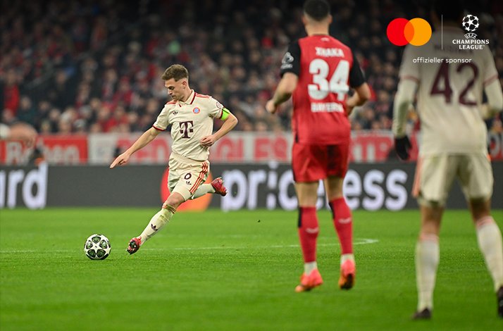 Football players photographed during UEFA Champions League match.
