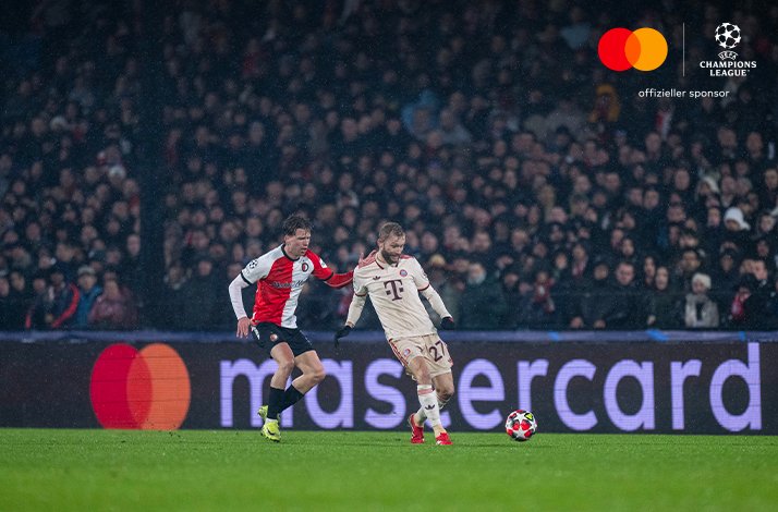 Football players photographed during UEFA Champions League match.