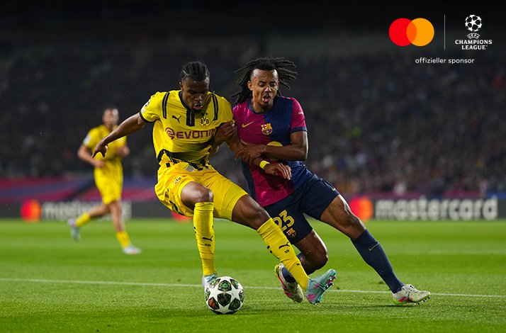 Football players photographed during UEFA Champions League match.
