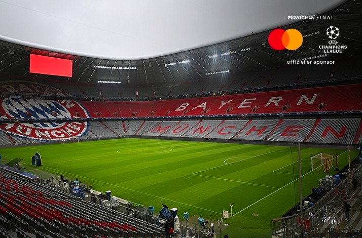 A stadium with Bayern Munich logo on the bleachers