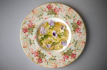 Fish carpaccio on a floral plate from Restaurant Badi.