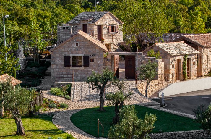 View at the garden and stone houses at Stella Croatica complex.