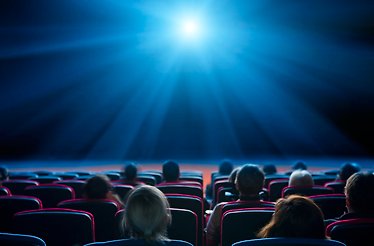 People in the cinema, viewed from the back