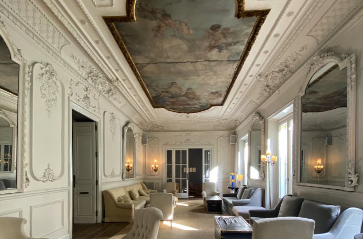 Interior of Club Matador in Madrid with ornate decor and painted ceiling.