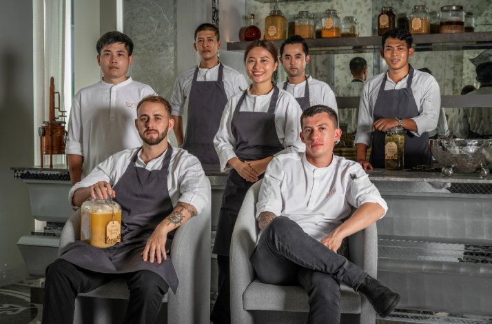Chef de cuisine Ricardo Nunes (seated, left) and his team