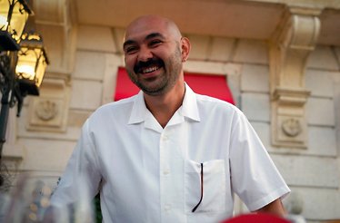 A bearded man smiling at the camera.