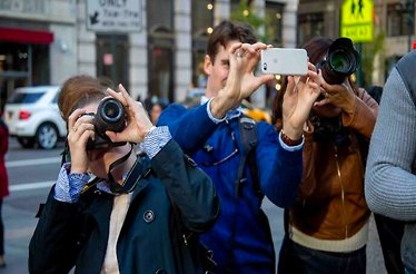 Participants taking pictures during hands-on photo safari through New York City's Midtown.