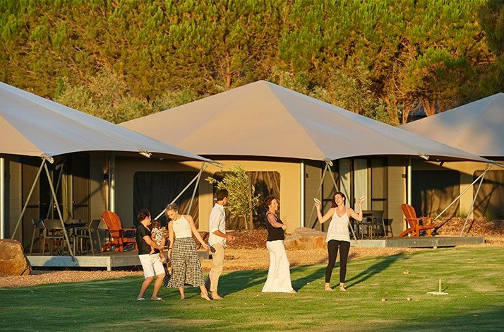 A group of  Olive Estate guests exploring the bungalows