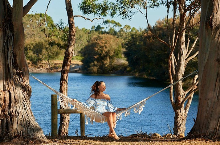 Woman in the hammock enjoying  Margaret River region view
