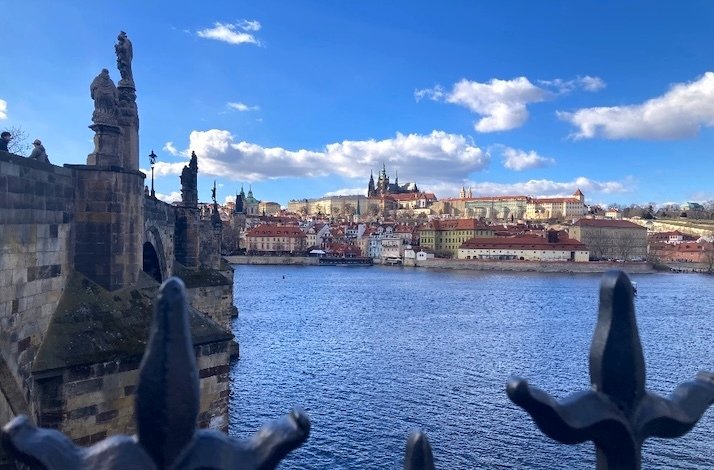 Charles Bridge is a medieval stone arch bridge that crosses the Vltava river in Prague, Czech Republic.
