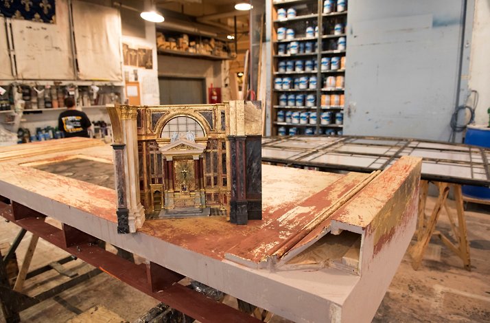 A miniature catholic church model placed on the wooden table  © Jonathan Tichler