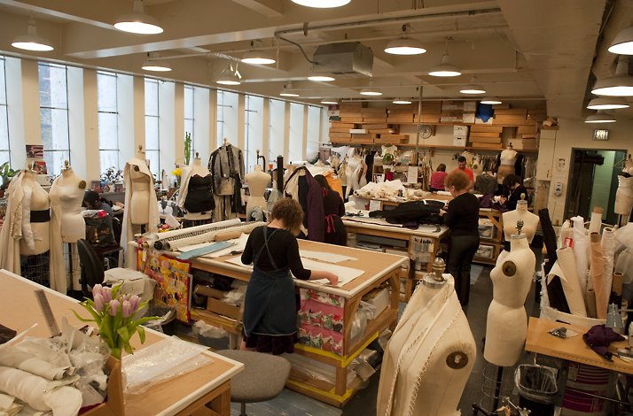 The costume department room with several employees engaged in clothing creationat the Metropolian Operan of New York. © Jonathan Tichler