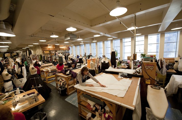 The Met Opera costume workshop bustling with artisans creating intricate stage attire.
