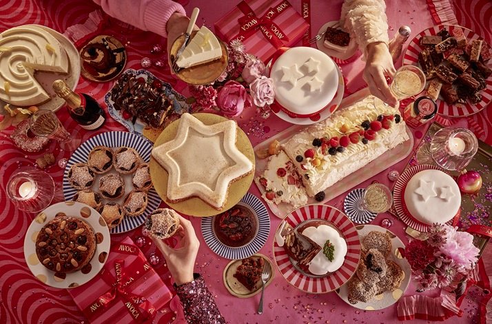 A table laden with festive desserts, drinks, and gifts under a red theme at Avoca Suffolk Street