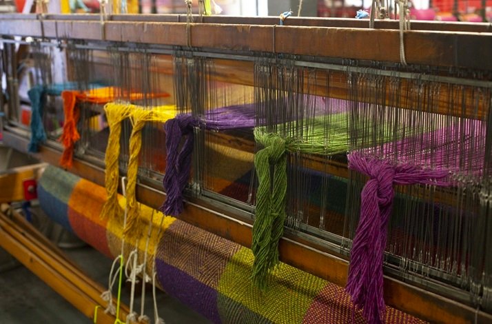 Process of traditional Irish weaving techniques in action.