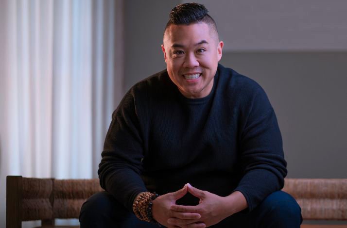 The portrait of the award-winning Chef Kelvin Cheung in black outfit smiling