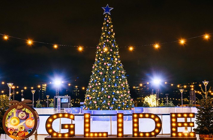 A decorated Christmas tree at Glide, an outdoor ice-skating rink.
