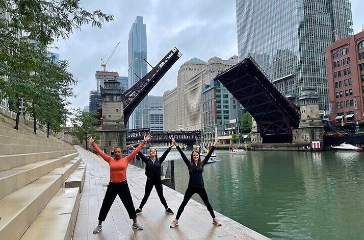 Participants of Chicago River Yoga Walk in front of Clark Street Bridge during the tour