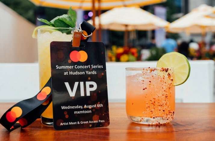 VIP pass for Summer Concert Series at Hudson Yards with Mastercard branding, next to two drinks.