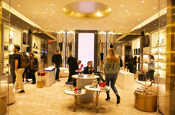 A luxurious shoe and accessories store featuring dazzling displays and golden accents.