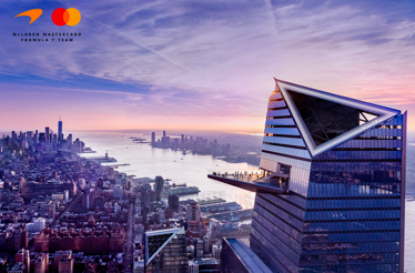 Aerial view of Hudson Yards and New York City at sunset.