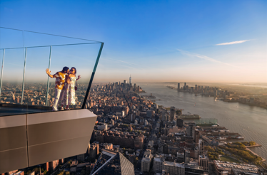 Couple at Edge observation deck, 30 Hudson Yards, New York City.